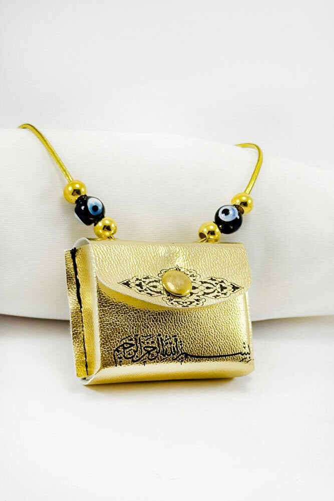 Altın Renkli El Yapımı Siyah Cam Nazarlı Deri Çantalı Mini Kur'an-ı Kerim Lastikli Oto Ayna Süsü